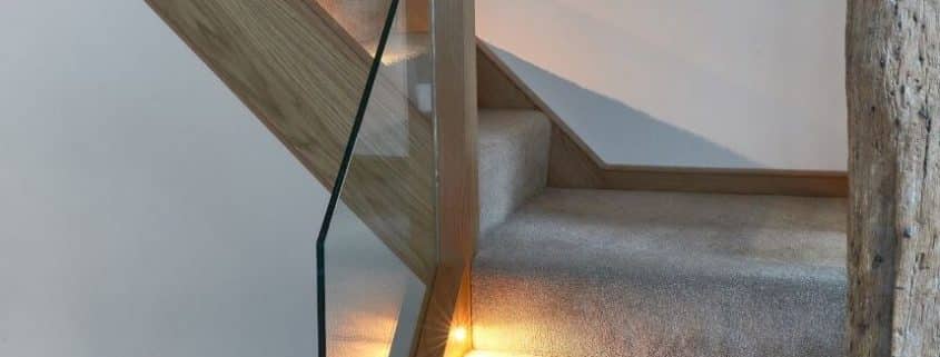 contemporary wood stairs with glass railing