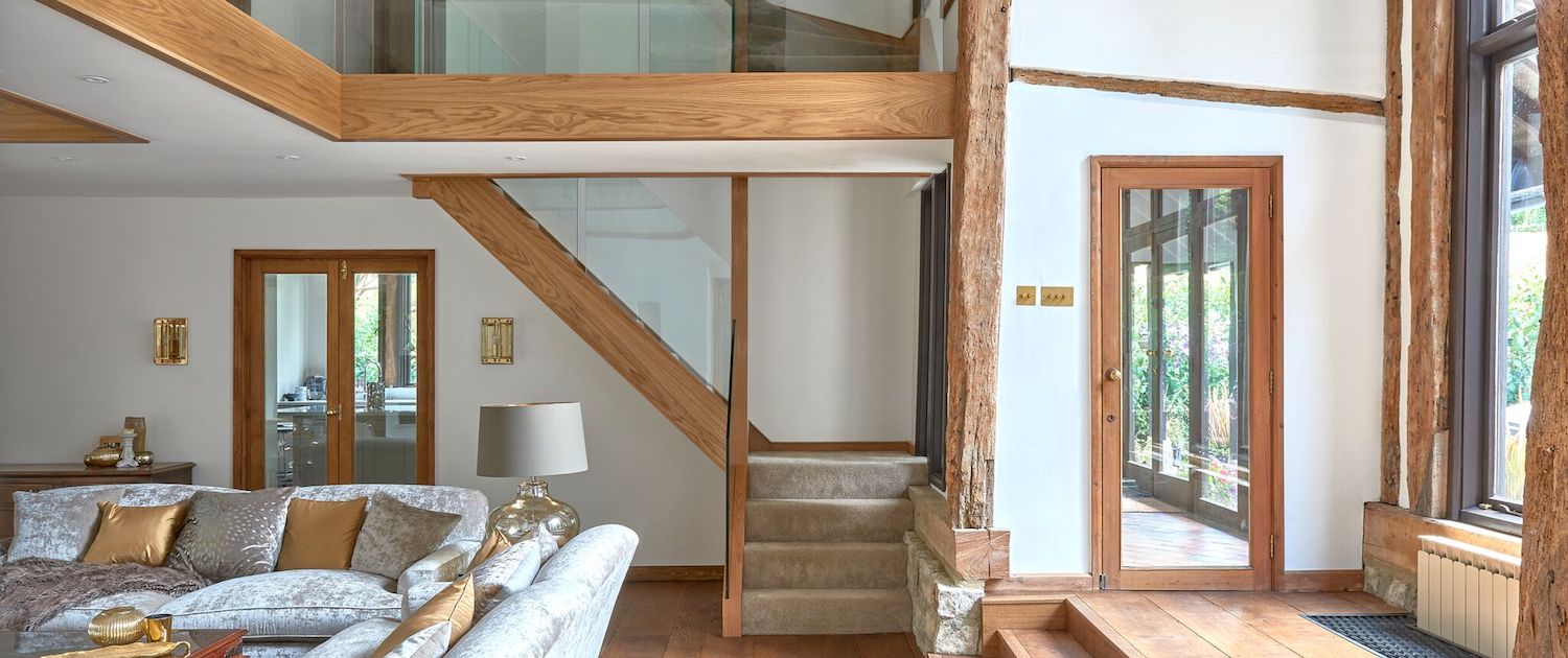 contemporary wood stairs with glass railing