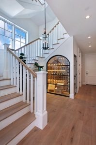 Bright staircase with wine storage alcove.