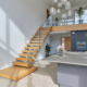Modern interior with wooden stairs and plants.