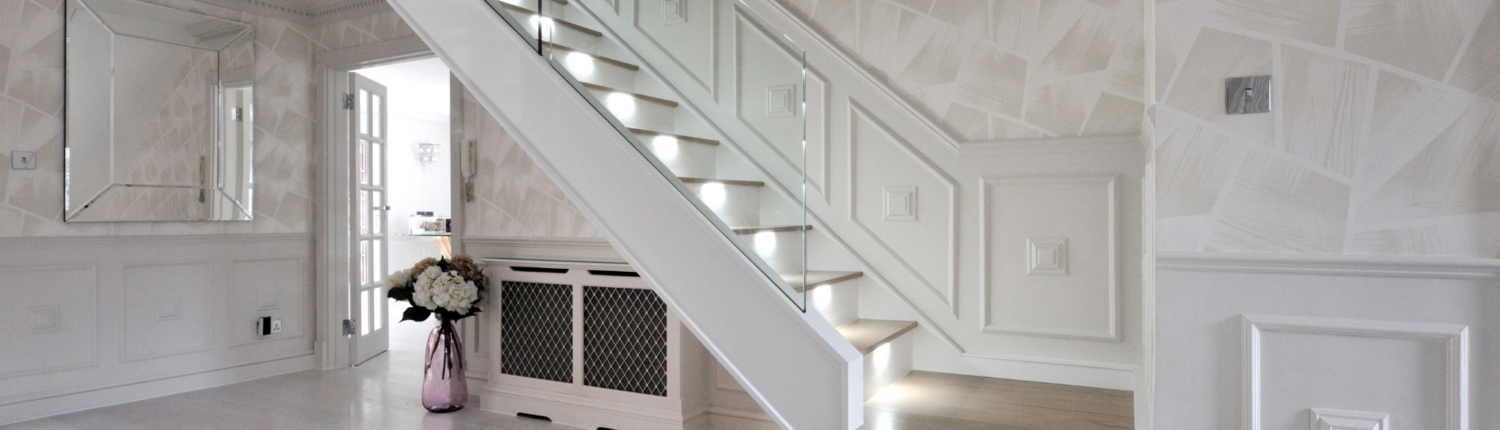 Glass Stairs modern glass staircase in a spacious room with white walls and wooden accents